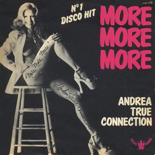 Andrea True in platform heels on a stool, showing off her killer legs.